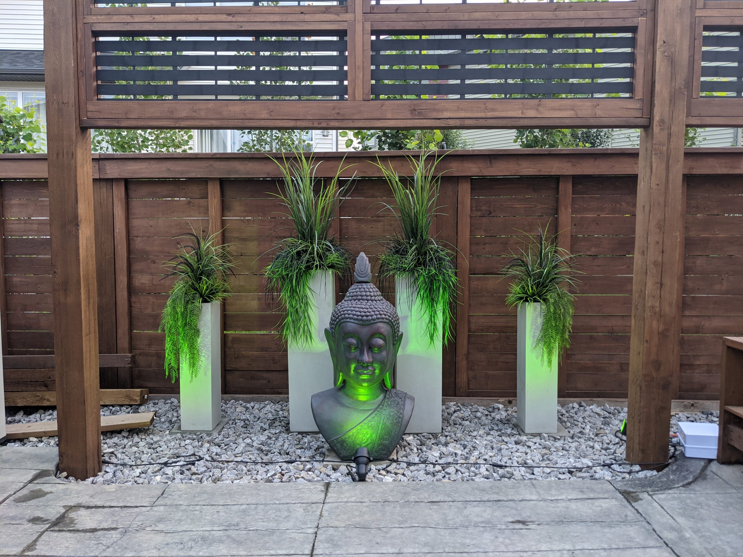 Watts Lights Landscape Lighting dressing up a Permanent Outdoor Feature in a Backyard